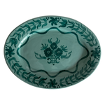Teal Blossom Serving Platter, oval glazed ceramic platter with a light teal base and hand-painted dark teal floral and leaf motifs.