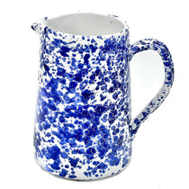 Speckled Pitcher, a white ceramic pitcher with striking cobalt blue speckles and a comfortable handle.