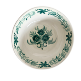 White Blossom Bowl, round ceramic bowl with a hand-painted dark teal floral pattern on a creamy white glaze.