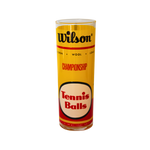 Vintage Wilson Championship Glass, tall cylindrical clear glass with yellow label, black Wilson, red Championship, Tennis Balls text.