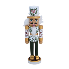 Custom Mistletoe Kiss Nutcracker, a white and green wooden figure with gold details, red mistletoe hat, and leafy pattern.