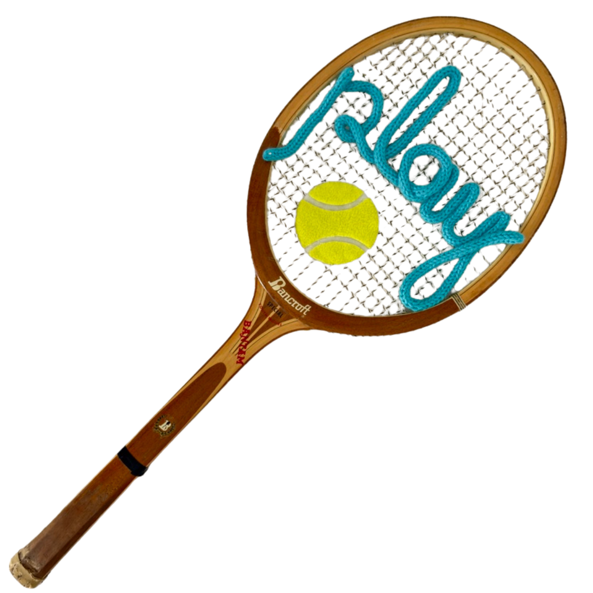 Vintage Bancroft Bantam wood tennis racquet with the word "Play" spelled in hand-knit turquoise yarn across the strings, with a felted tennis ball detail, one-of-a-kind sporting wall art from Two Webster.