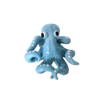 Light Blue Octopus Objet in glossy ceramic with white sucker details and expressive eyes on white background