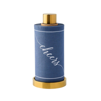 Mystic Blue Cocktail Napkin Roll with white 'cheers' script and lines on fabric, displayed in a gold metal stand.