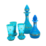 Portieux Vallerysthal Blue Opaline Sherry Set: two decanters, three flared glasses with gold stars and bands