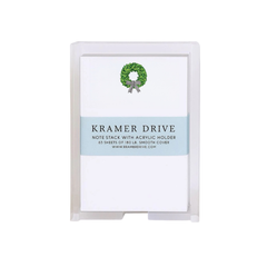 Boxwood Wreath Acrylic Note Stack, clear acrylic holder, white paper with green boxwood wreath and striped bow, on white.