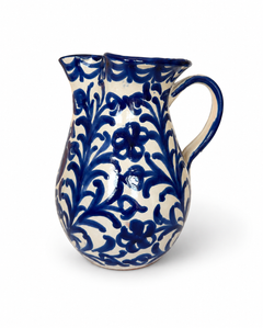 Pomegranate Round Pitcher, cream glazed ceramic with deep blue floral vine pattern, double spout, and handle.