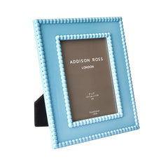 Bobbin Lacquer Frame, light blue rectangular with bobbin detail, standing on its easel back.