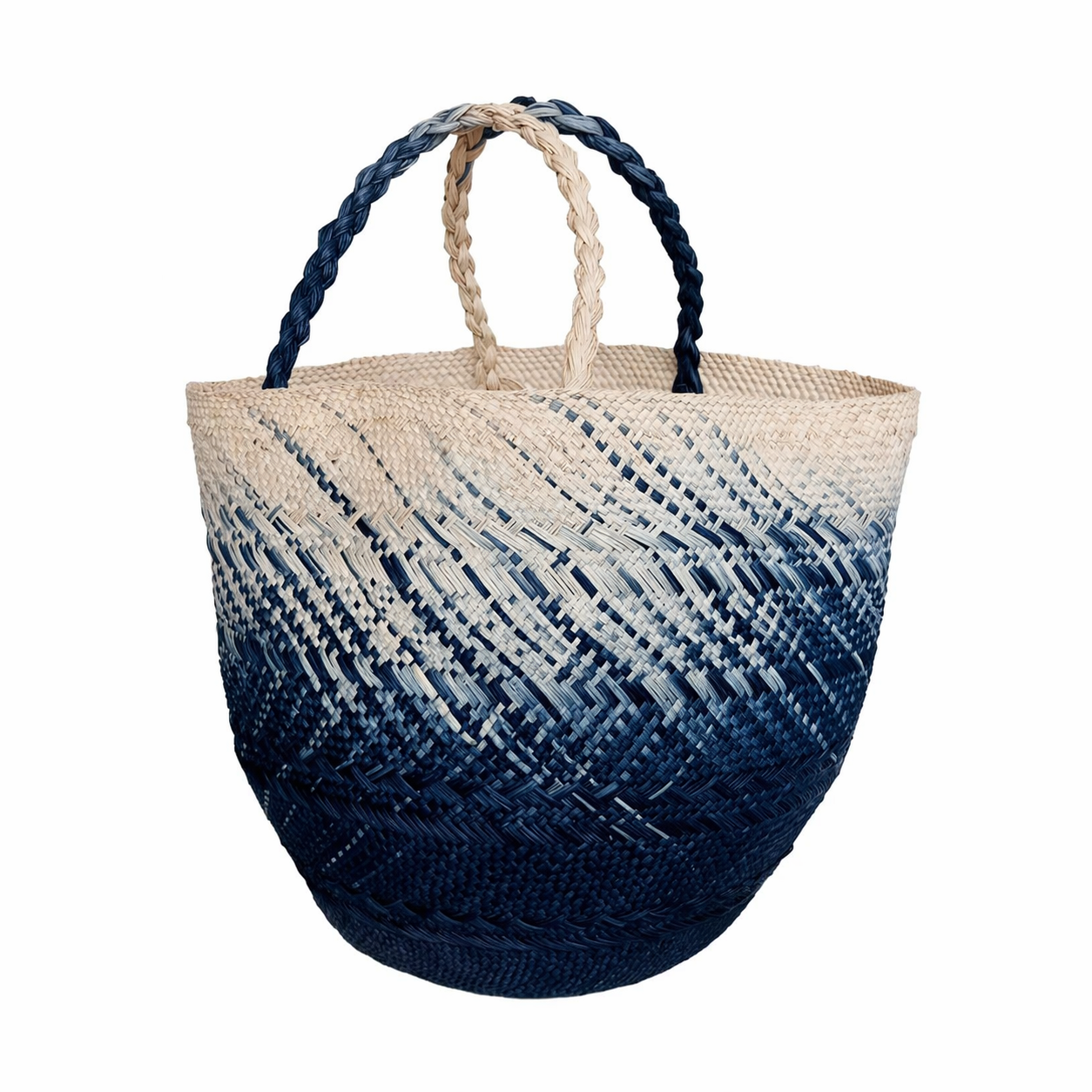 Ombre Iraca Fiber Floor Basket in woven natural and navy blue with gradient pattern and braided handles
