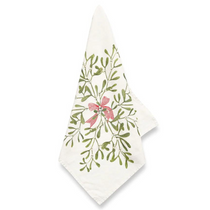 Mistletoe Kiss Napkin in ecru cotton fabric with green mistletoe, white berries, and a red striped bow pattern, folded diagonally.