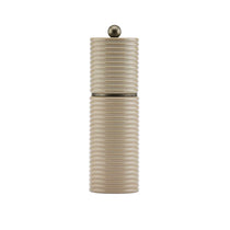 Sophie Patterson Reed Salt/Pepper Mill in light beige with horizontal reeded texture, bronze knob, cylindrical shape on white background.