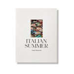 Italian Summer by Natalie Obradovich, a cream hardcover book featuring an inset photo of colorful striped beach umbrellas, subtly displayed.