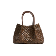 The Petite Simone | Chocolate woven leather top-handle bag with a structured trapezoidal shape, shown on a white background.