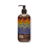 Mind and Body Wash in a dark brown plastic pump bottle with vibrant red, orange, yellow, green, and blue wavy lines, on white.