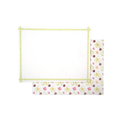 Lucy Stationery Set, a white notecard with a light green dotted border, overlapping an envelope with pink, yellow, and brown whimsical floral paper.