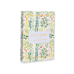Anna Spiro: A Life in Pattern First Edition, hardcover, cream cover with multicolor floral pattern and gold border, standing upright.
