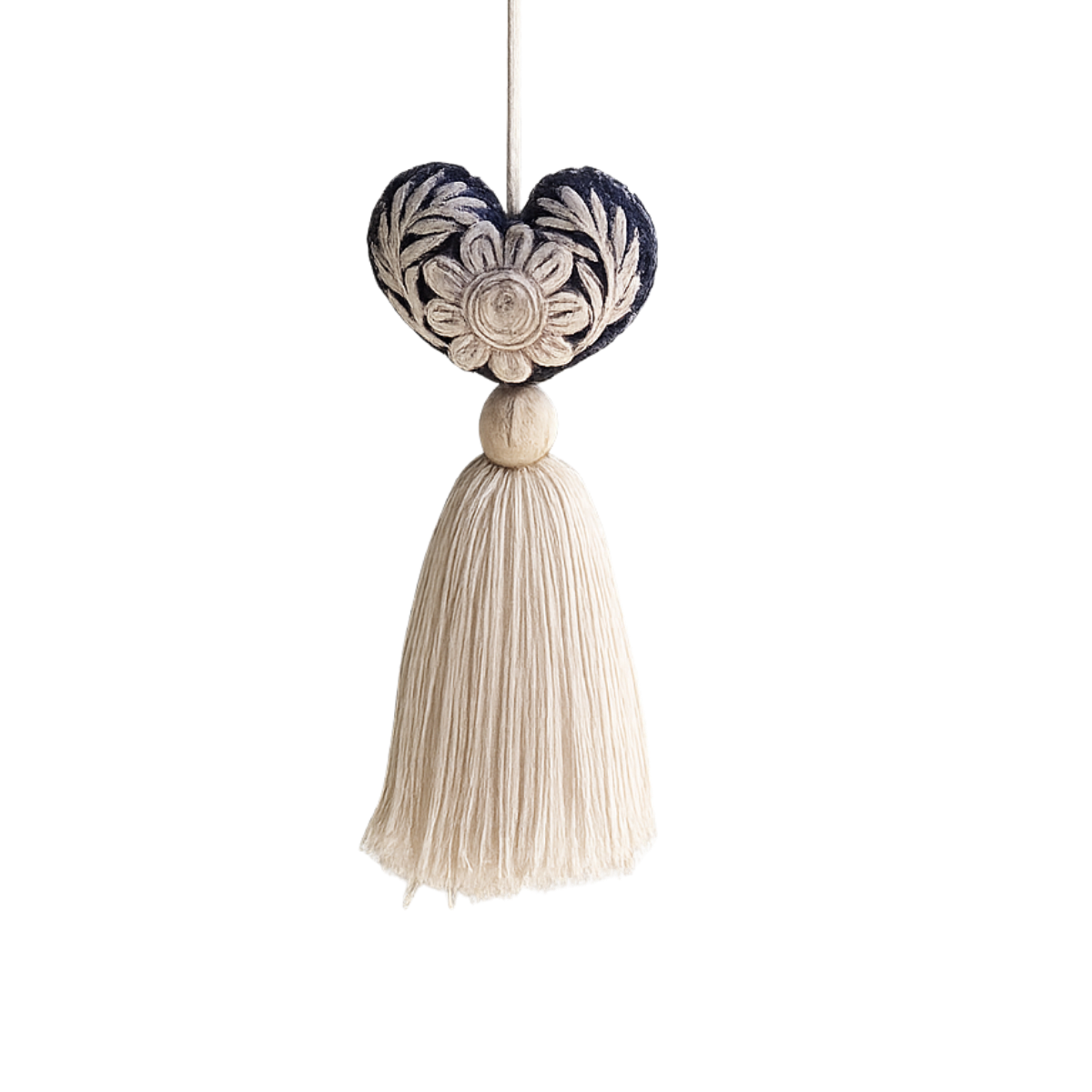 Mexican Heart Tassel: dark blue embroidered heart with cream floral design and a cream thread tassel, hanging.