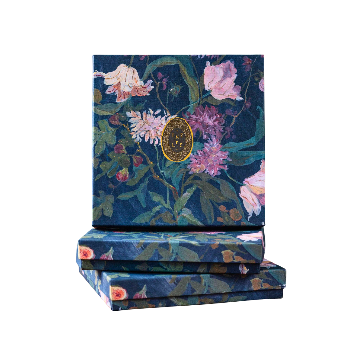 2027 Calendar in the Noir Box, dark blue paper box with a vibrant pink and green floral botanical pattern, stacked on a white background.