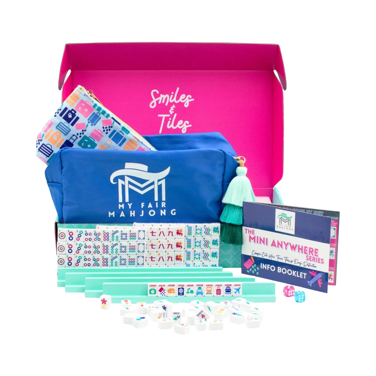 The Anywhere Series | Classic Mahjong Set with white tiles, mint green racks, blue fabric bags, dice, and booklet, all in an open hot pink box.