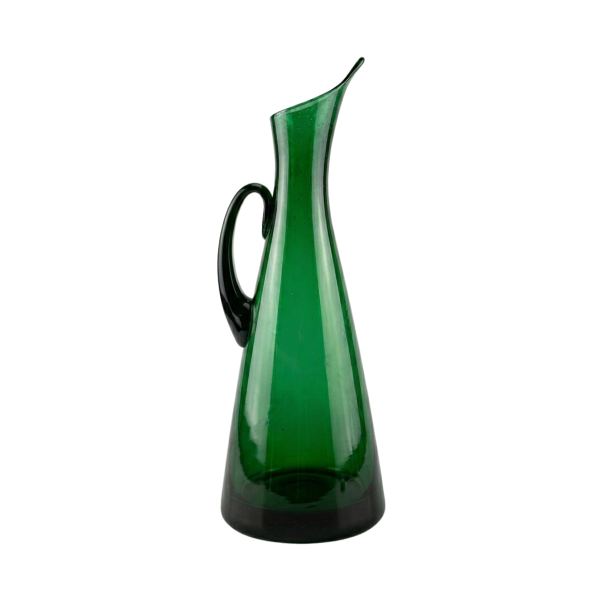 Blenko Glass Floor Pitcher in tall, tapered emerald green glass with a black handle and elegant flared spout.