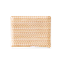 Chandler Tray in Petal, a acrylic tray with rounded corners, cream with a peach and gold wavy stylized tulip pattern.