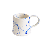 Blue Splatter Barrel Mug in white ceramic with vibrant blue splatter pattern, isolated on a clean white background.