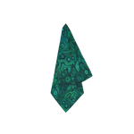 Malachite Linen Napkin in Emerald Green, a vibrant napkin with a swirling malachite ring pattern, folded.