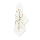 Our June Floral Linen Napkin, white linen with a delicate wildflower pattern in pink, purple, and green, elegantly folded.