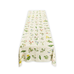 Botanical Tiles Linen Tablecloth, a rectangular ecru linen tablecloth with colorful tiled botanical illustrations, draped on a table.