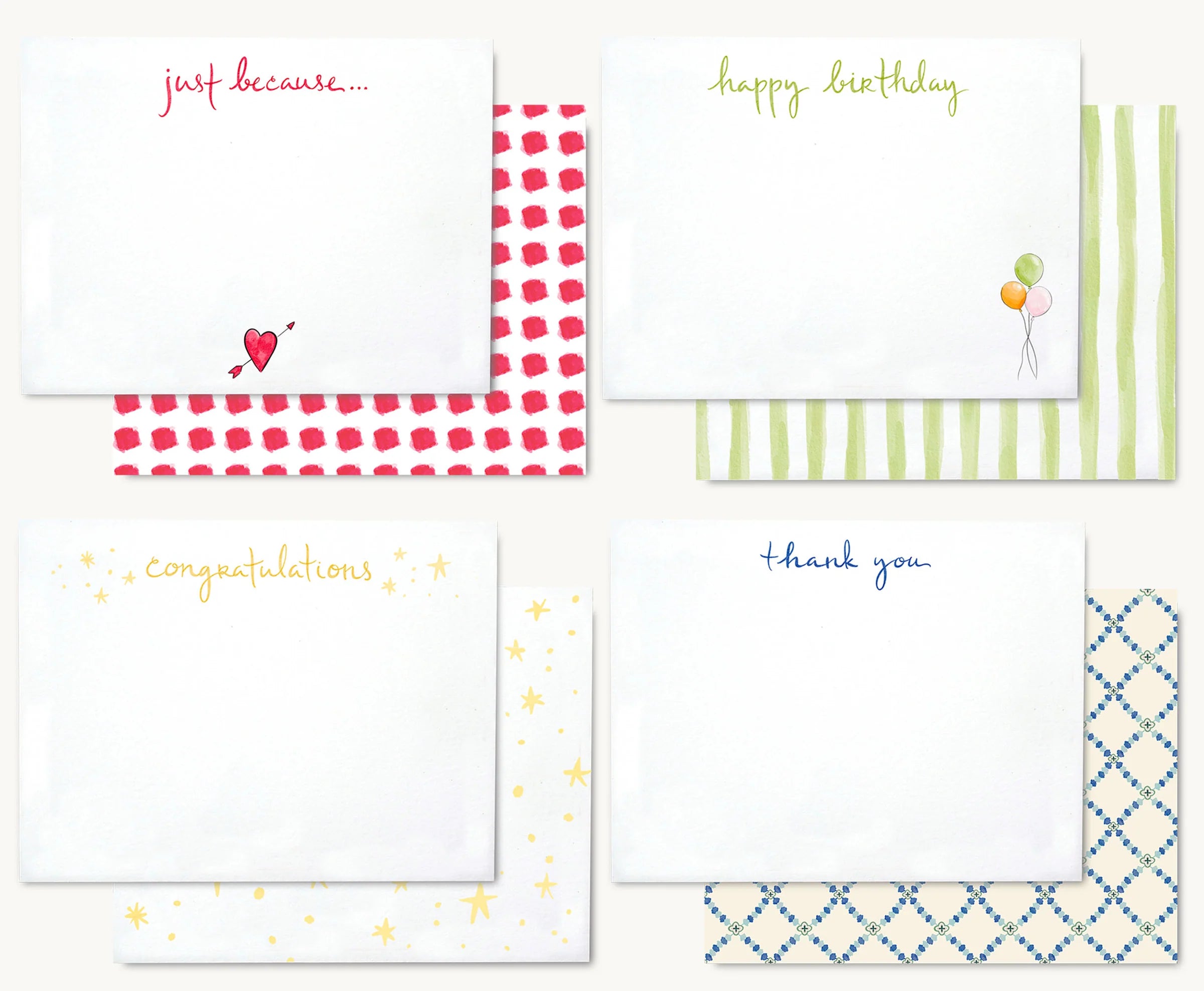 Every Occasion Stationery Set: white paper cards with colorful text and patterned envelopes (red, green, yellow, blue). Flat lay.