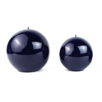 Lacquer Ball Candle, Small, a compact, glossy navy blue wax sphere displayed with a larger candle on a clean white background.